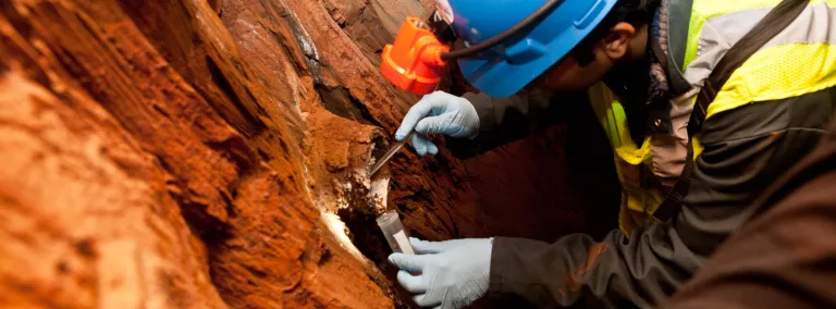 Researcher gathers sample from the 4850 Level.