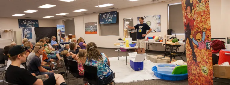 Science Steve performs an experiment on Neutrino Day.