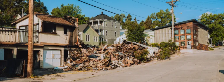 The remnants of a burned and demolished apartment building