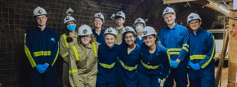 a group of students in an underground drift 