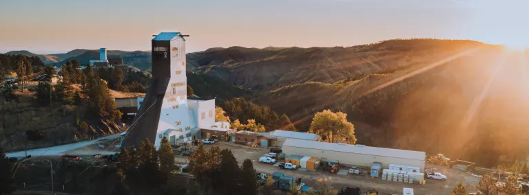 Drone overview of the Ross Headframe with the sun rising in the background 