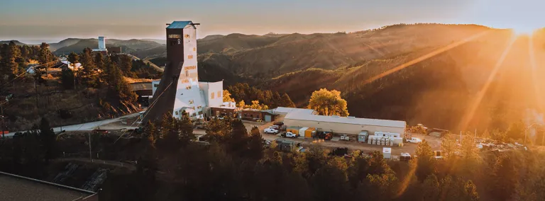 drone shot shows a sunburst over the SURF facility 