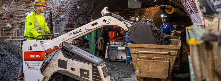 Man drives a bobcat underground