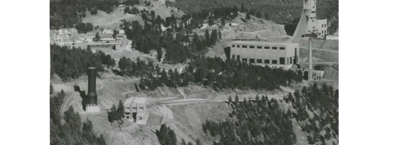 Black and white photo of headframes pictured from afar