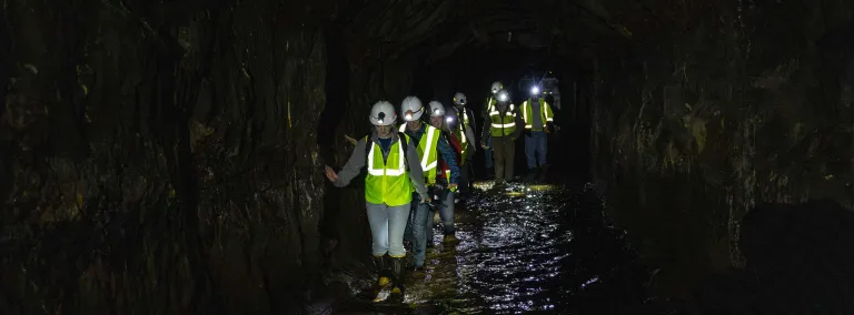 SURF summer 2022 interns explore the 1700 level of the Sanford Underground Research Facility.