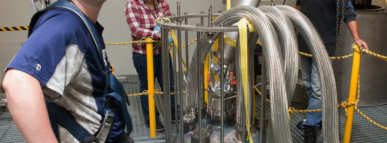 Doug Tiedt, postdoctoral researcher with the University of Maryland, stands in the Davis Cavern, where the LUX-ZEPLIN dark matter detector is being assembled.