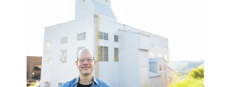 Jaret Heise in front of the Yates Headframe