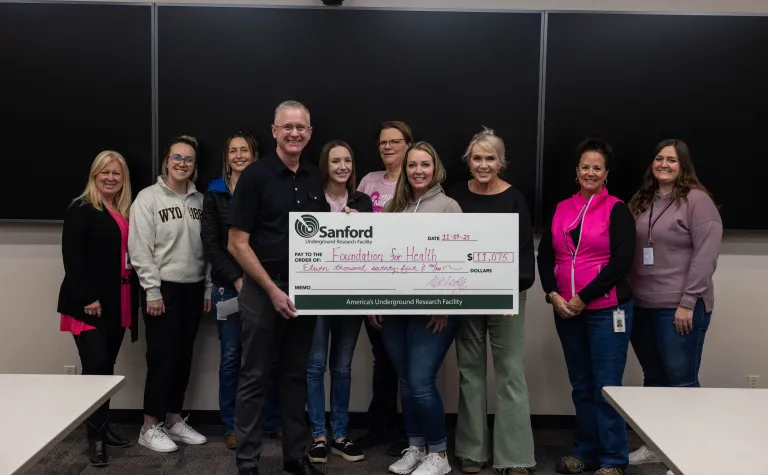 SDSTA Staff present a check to the Foundation for Health for the 2023 Breast Cancer Awarness Month Fundraiser