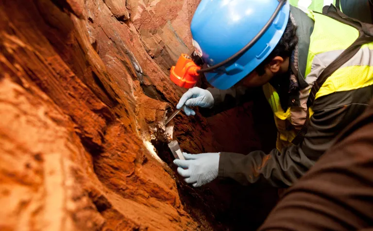 Researcher gathers sample from the 4850 Level.