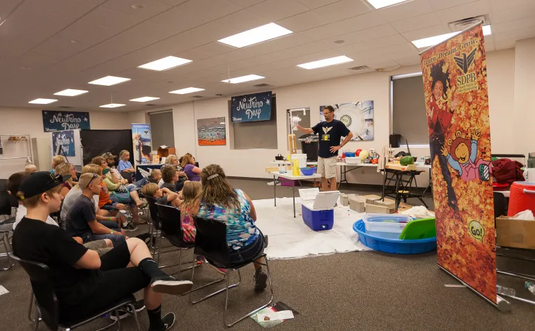 Science Steve performs an experiment on Neutrino Day.