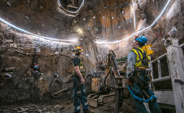 two people stand at the base of the ore pass