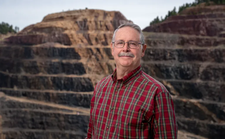 Vardiman stands in front of the open cut