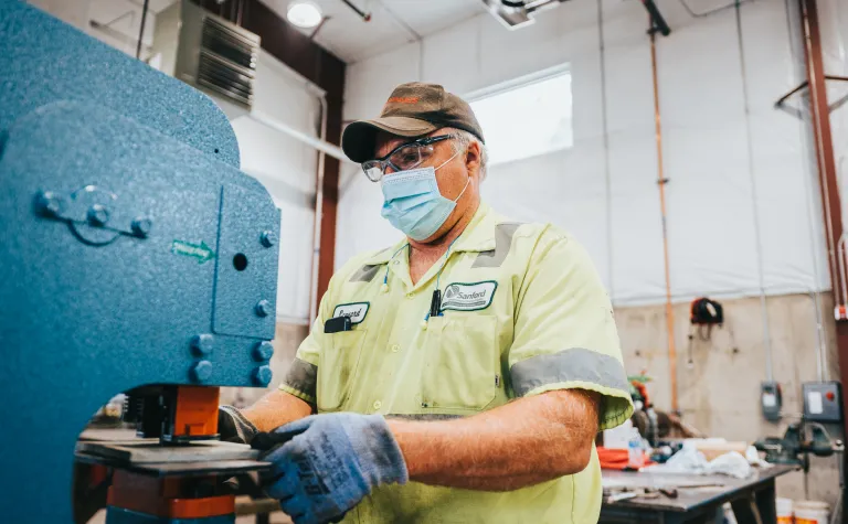 technician operates an ironworker