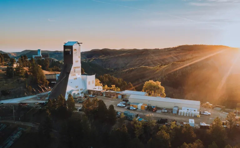 Drone overview of the Ross Headframe with the sun rising in the background 