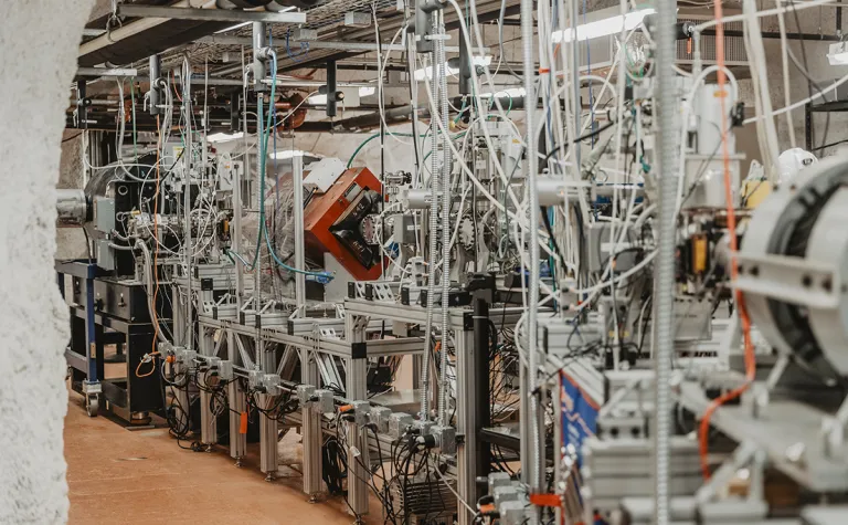 a complex particle accelerator in an underground laboratory 