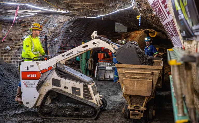 Man drives a bobcat underground