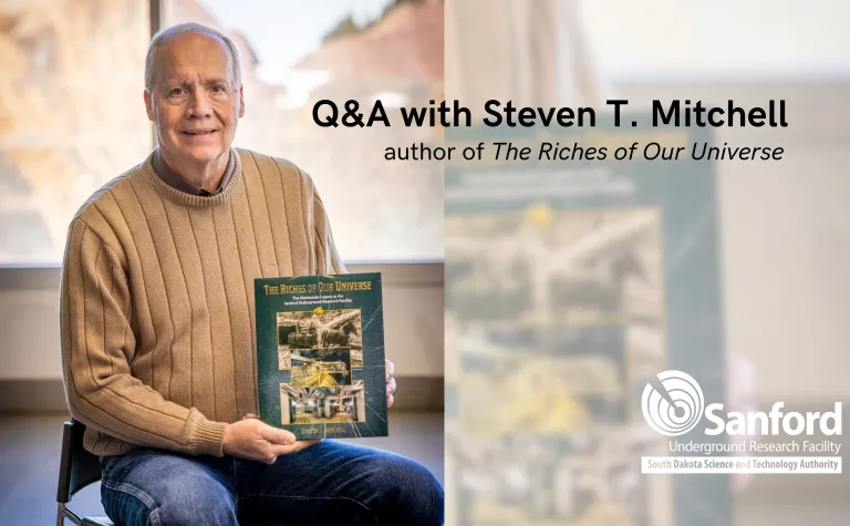 Steven Mitchell holds a copy of his new book 