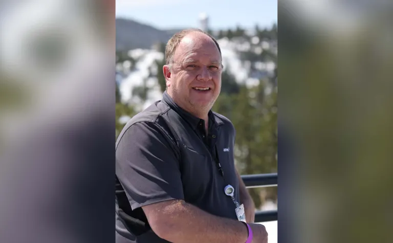 Photo of smiling person in front of Kirk Canyon