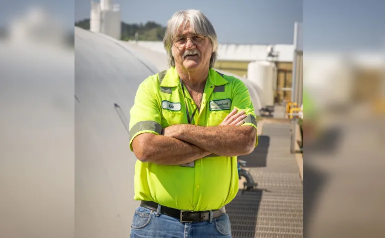 Man standing by the Wastewater Treatment Plant