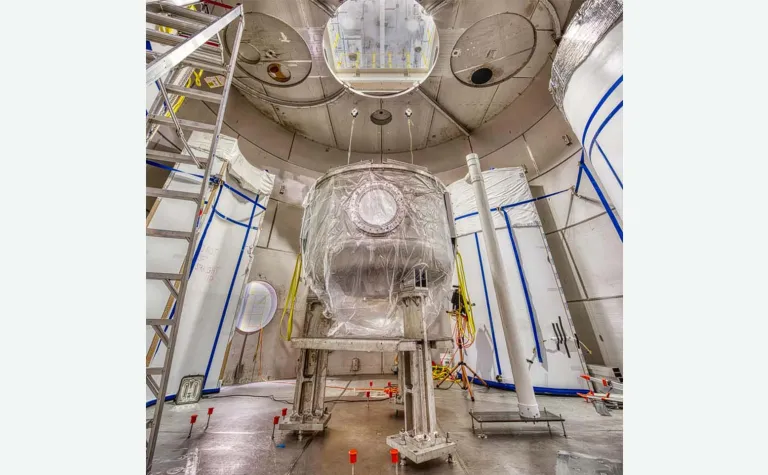 Inside the LZ water tank, assembly has begun on the Outer Cryostat Vessel.