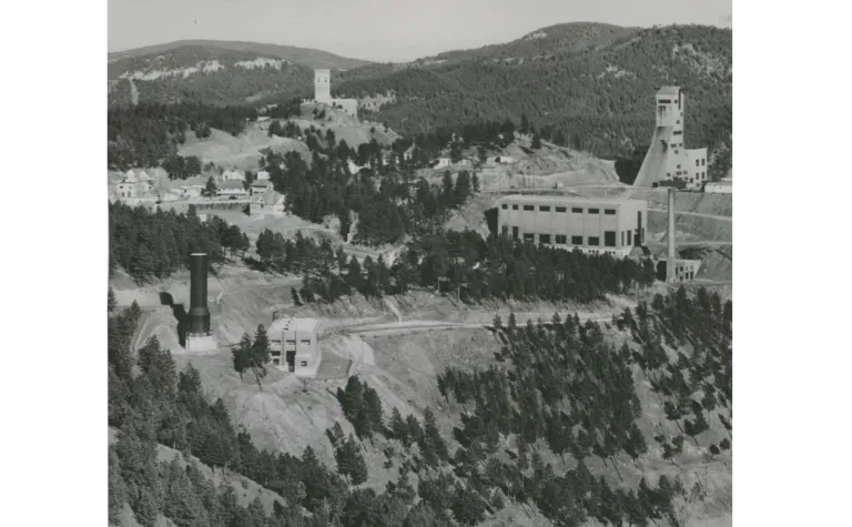 Black and white photo of headframes pictured from afar