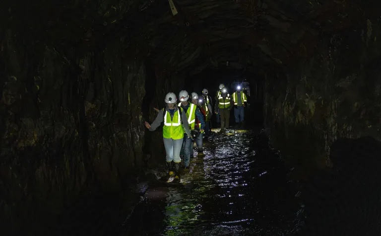 SURF summer 2022 interns explore the 1700 level of the Sanford Underground Research Facility.