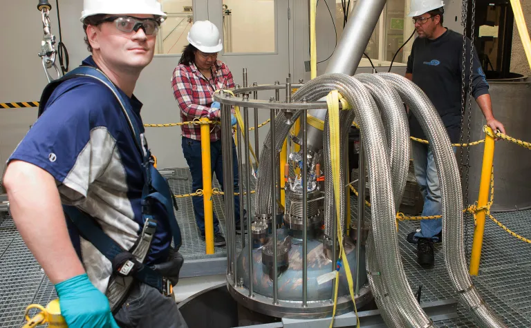 Doug Tiedt, postdoctoral researcher with the University of Maryland, stands in the Davis Cavern, where the LUX-ZEPLIN dark matter detector is being assembled.