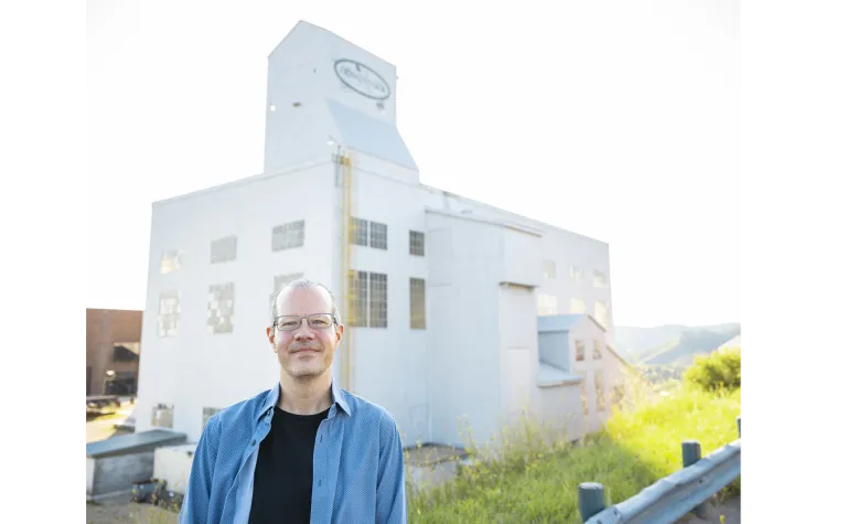 Jaret Heise in front of the Yates Headframe