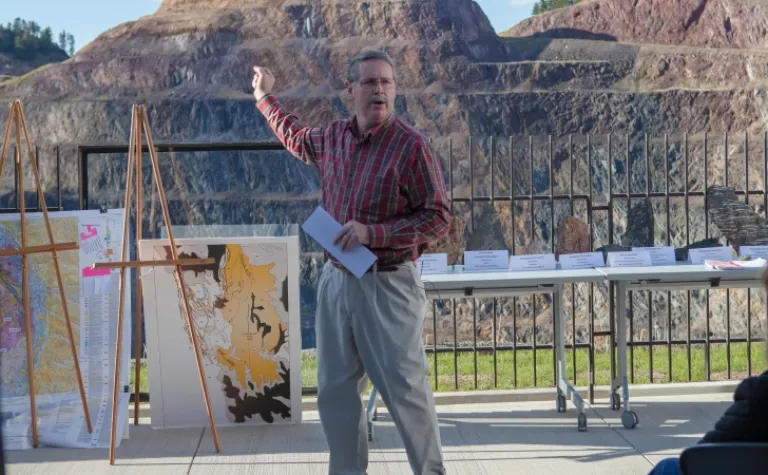 David Vardiman speaks in front of the Open Cut in Lead S.D.