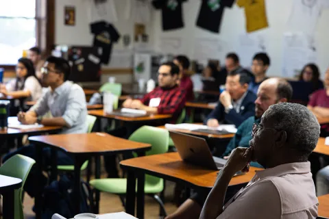 Attendees listen in a classroom setting to one of many presentations during the 2023 CETUP* summer workshop at SURF. 