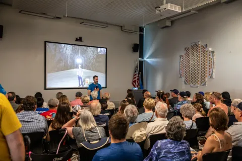 The crowd gathered for the live feed from underground during Neutrino Day.