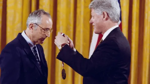 John Bahcall receiving the National Medal of Science from President Clinton (~1998)