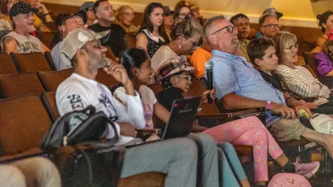 The crowd in the Homestake Opera House enjoying the performance and lecutrues at Neutrino Day 2024