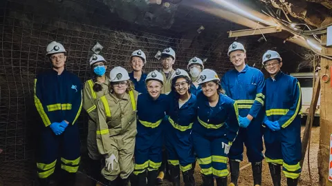 a group of students in an underground drift 